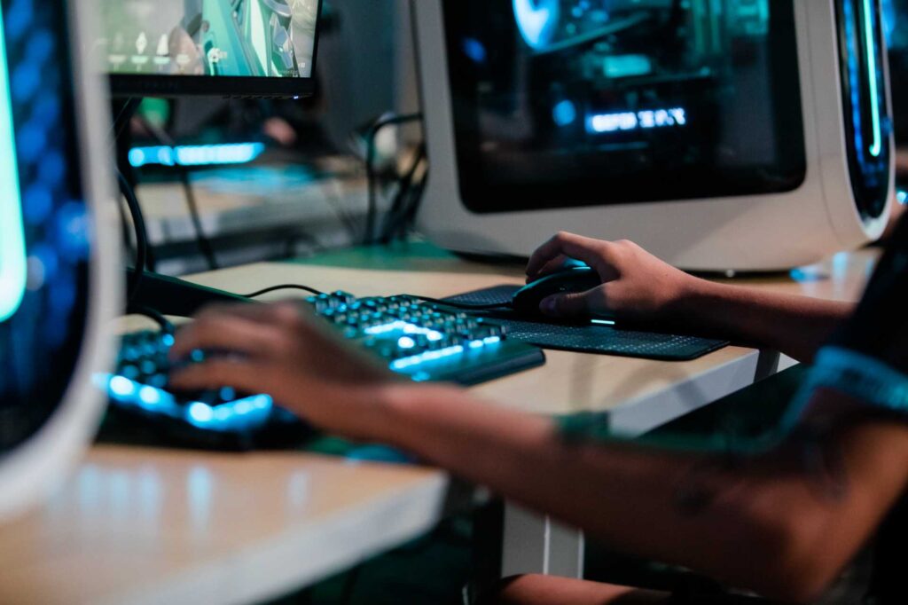 close up of youth using gaming keyboard and mouse