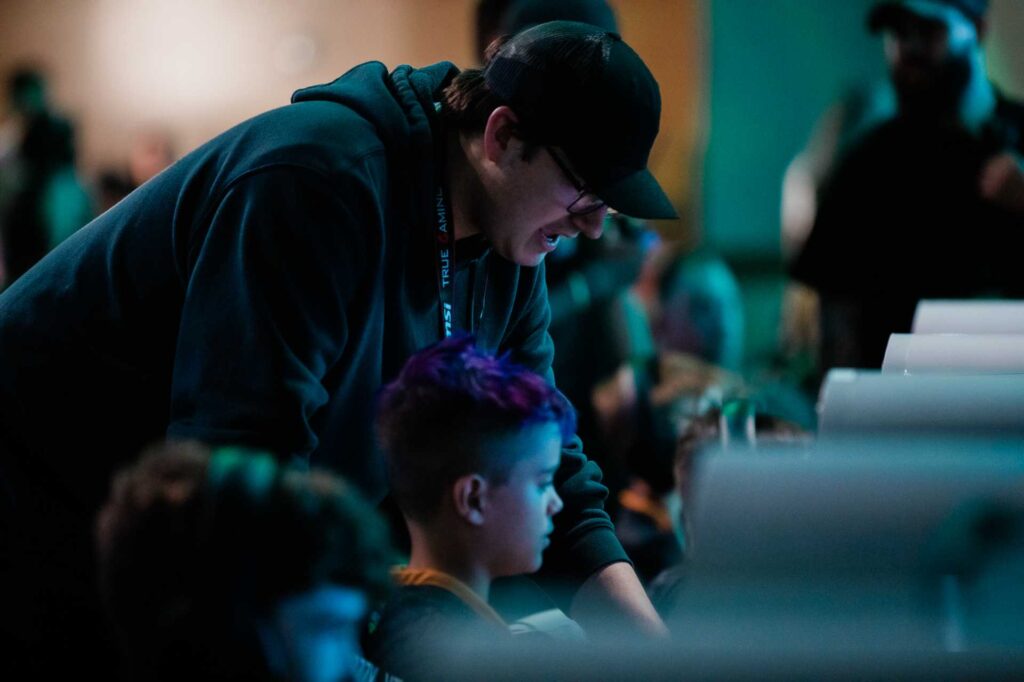 xp league coach supervises young gamers